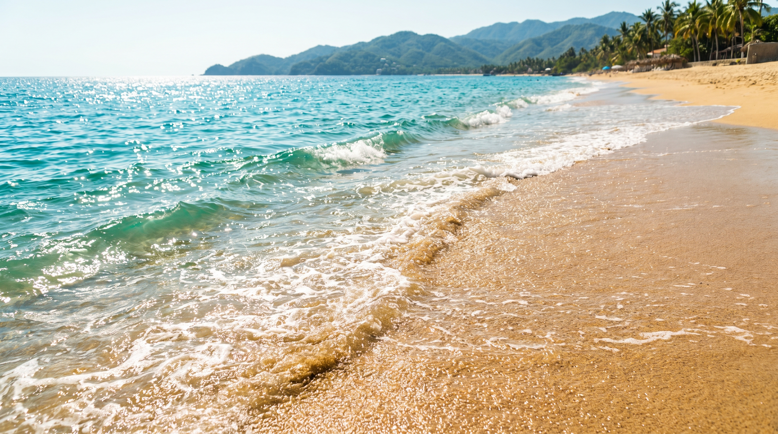 A family wading in shallow, calm water on a wide sandy beach in Puerto Vallarta